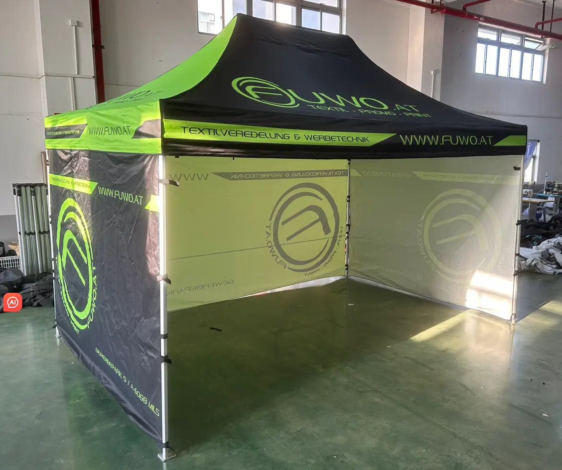 A sturdy, black and lime-green pop-up gazebo tent featuring "FUWO.AT" branding and contact information printed clearly on the fabric canopy and walls, displayed inside a warehouse.